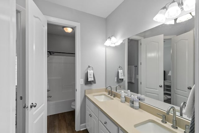 306 Halifax Dr, Dothan, AL 36305 - full bathroom featuring double vanity, wood finished floors, and tub / shower combination