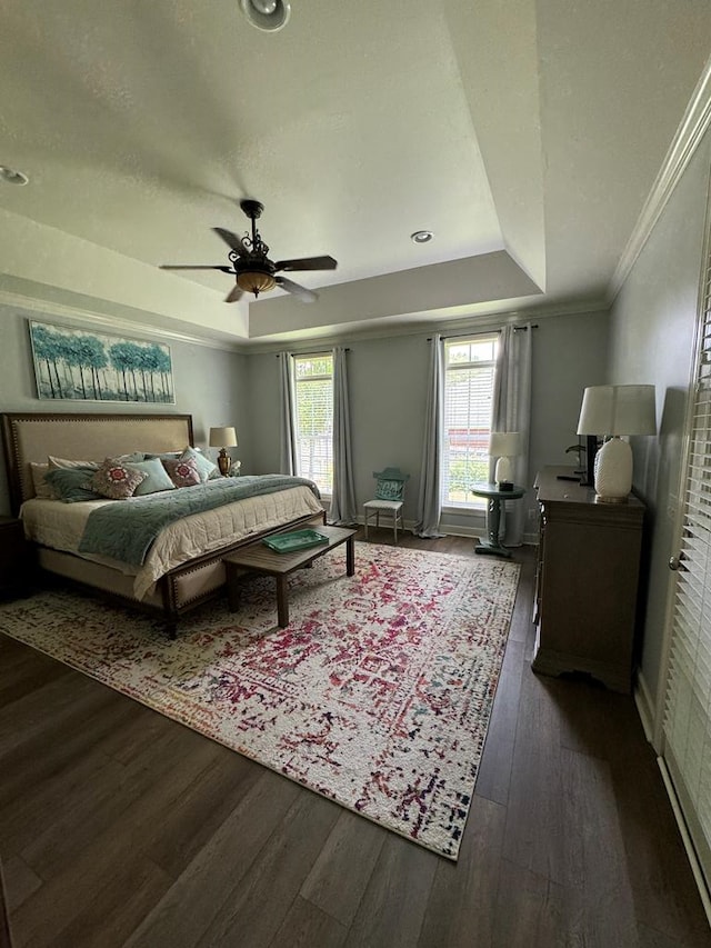 306 Halifax Dr, Dothan, AL 36305 - bedroom with a tray ceiling, dark wood-type flooring, ornamental molding, and a ceiling fan