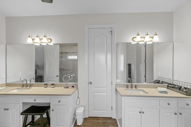 306 Halifax Dr, Dothan, AL 36305 - bathroom featuring vanity, a tile shower, and wood finished floors