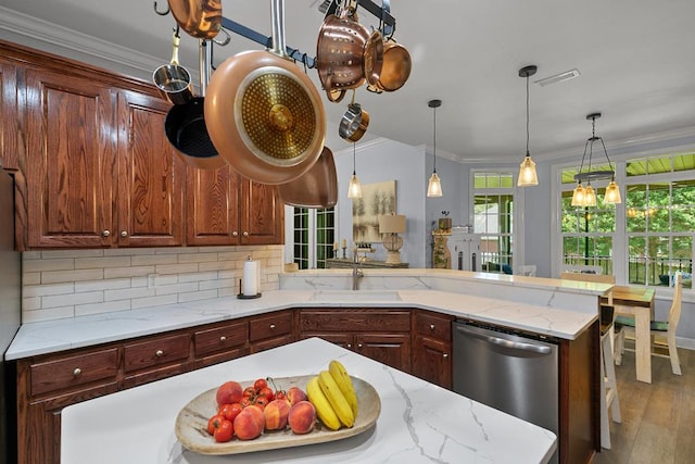 306 Halifax Dr, Dothan, AL 36305 - kitchen featuring stainless steel dishwasher, ornamental molding, decorative backsplash, wood finished floors, and decorative light fixtures