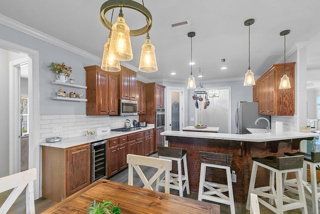306 Halifax Dr, Dothan, AL 36305 - kitchen featuring beverage cooler, stainless steel appliances, light countertops, crown molding, and recessed lighting