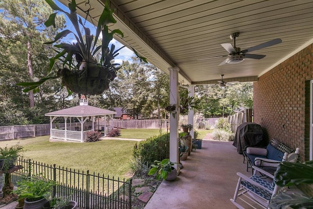 306 Halifax Dr, Dothan, AL 36305 - fenced backyard with a gazebo, a ceiling fan, grilling area, and a patio
