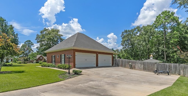 306 Halifax Dr, Dothan, AL 36305 - view of side of home with concrete driveway, brick siding, a garage, and roof with shingles