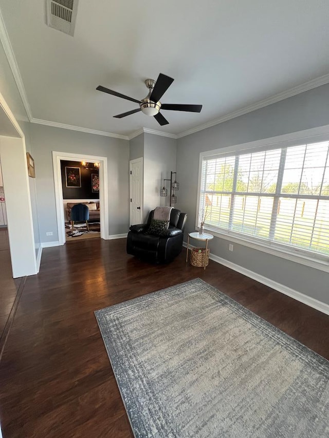 441 N Bay Springs Rd, Dothan, AL 36303 - living area with baseboards, dark wood finished floors, crown molding, and ceiling fan