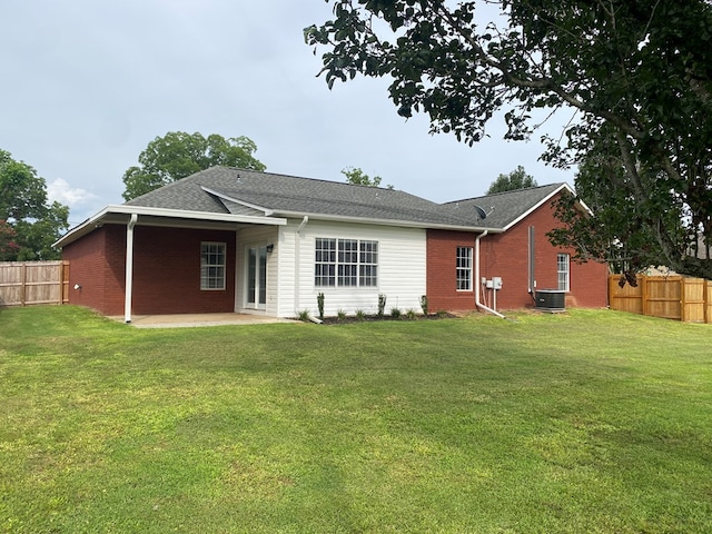 441 N Bay Springs Rd, Dothan, AL 36303 - back of house featuring a fenced backyard, brick siding, a patio, and roof with shingles