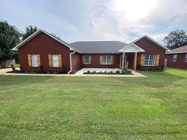 441 N Bay Springs Rd, Dothan, AL 36303 - ranch-style house with brick siding, a front yard, and a shingled roof