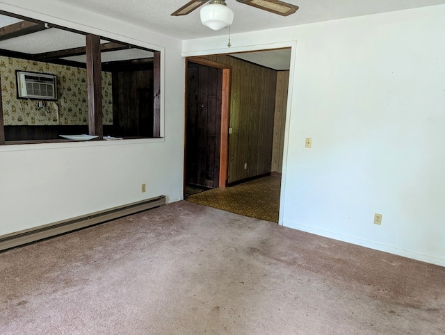 108 Imperial Dr, Eufaula, AL 36027 - carpeted spare room with a baseboard radiator, ceiling fan, and a wall mounted air conditioner
