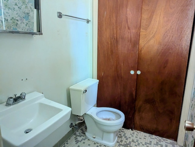 108 Imperial Dr, Eufaula, AL 36027 - bathroom with a sink, toilet, and tile patterned flooring