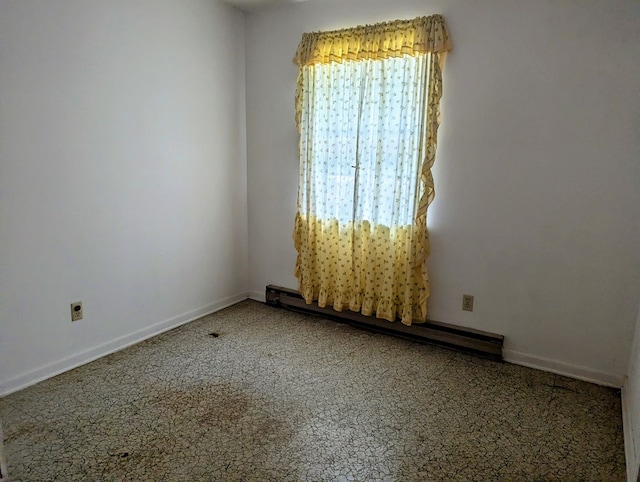 108 Imperial Dr, Eufaula, AL 36027 - empty room featuring a baseboard heating unit and baseboards