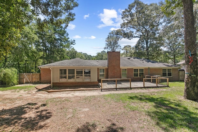 1005 Rampart Dr, Dothan, AL 36303 - back of house featuring brick siding, a chimney, and a wooden deck