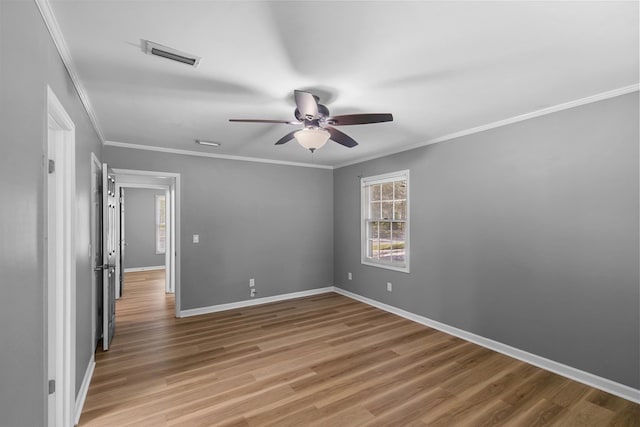 1005 Rampart Dr, Dothan, AL 36303 - spare room with a ceiling fan, ornamental molding, and light wood finished floors