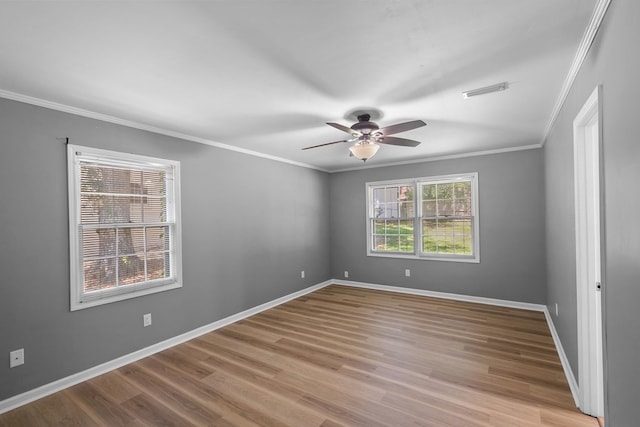 1005 Rampart Dr, Dothan, AL 36303 - spare room featuring a ceiling fan, ornamental molding, and wood finished floors