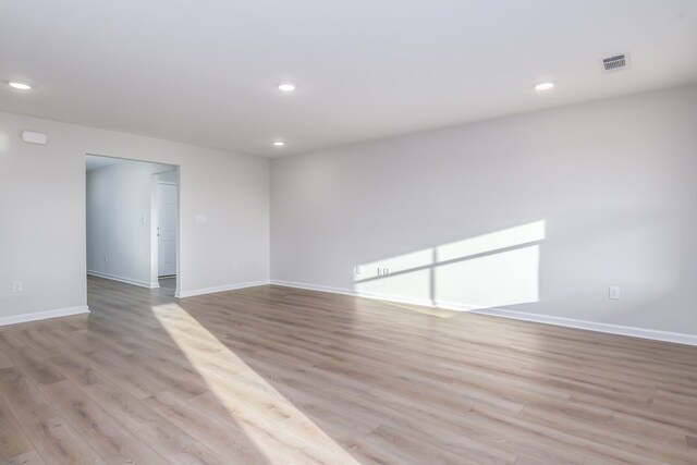 1017 Sandbed Rd, Newton, AL 36352 - empty room featuring light wood-style floors and recessed lighting