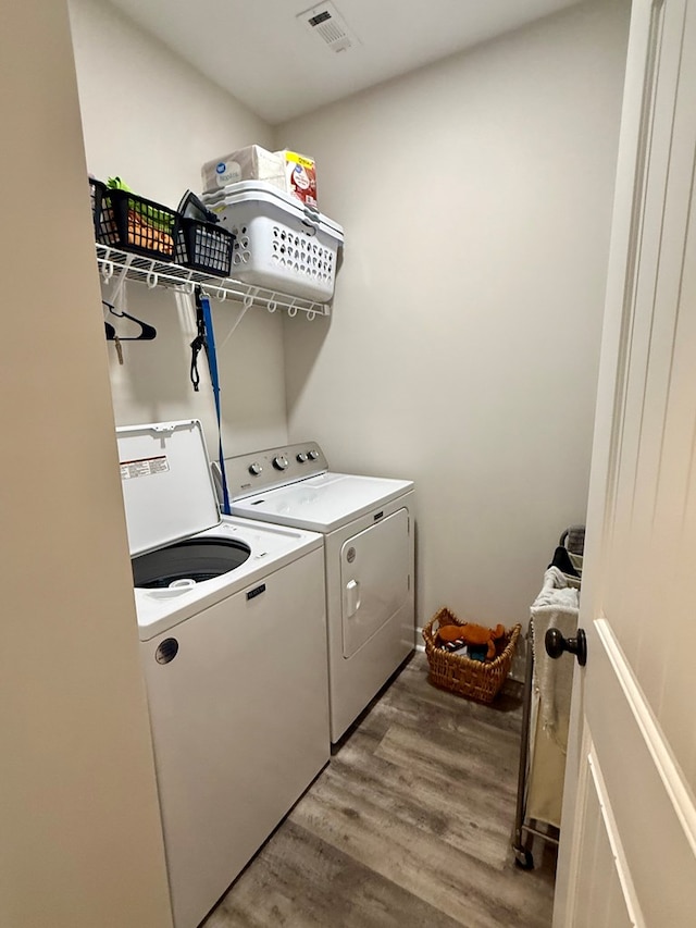 106 Sandpiper Ln, Dothan, AL 36301 - washroom with washer and clothes dryer and light wood-type flooring