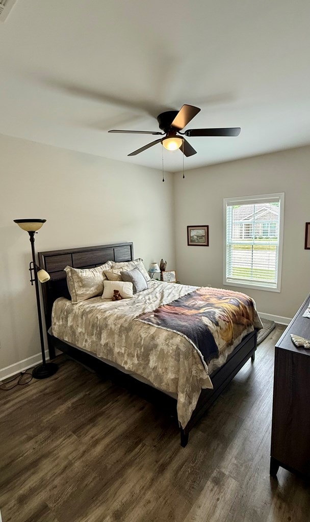 106 Sandpiper Ln, Dothan, AL 36301 - bedroom featuring dark wood-style flooring, baseboards, and a ceiling fan