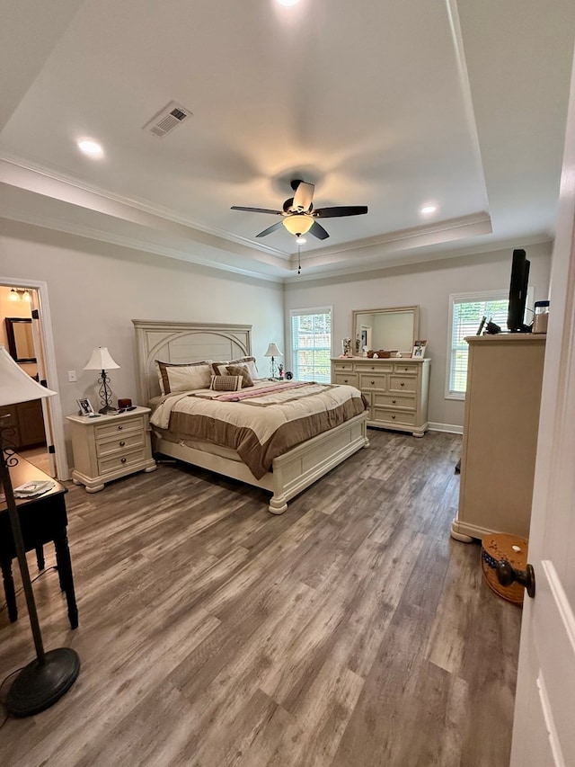 106 Sandpiper Ln, Dothan, AL 36301 - bedroom with a raised ceiling, wood finished floors, crown molding, recessed lighting, and baseboards