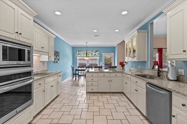 108 Haddington Park Ln, Dothan, AL 36305 - kitchen with appliances with stainless steel finishes, ornamental molding, a peninsula, recessed lighting, and plenty of natural light