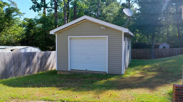 garage with a yard