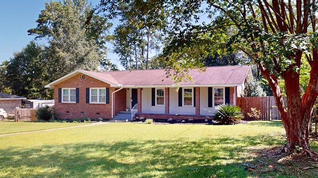 single story home featuring a front yard