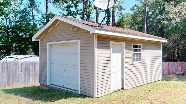 garage featuring a lawn