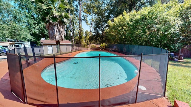 view of pool with a storage unit