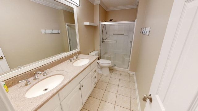 bathroom featuring tile patterned flooring, crown molding, toilet, a shower with door, and vanity