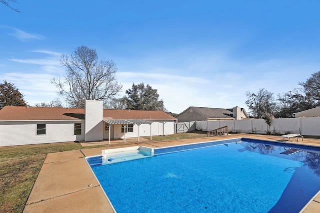 view of swimming pool with a diving board