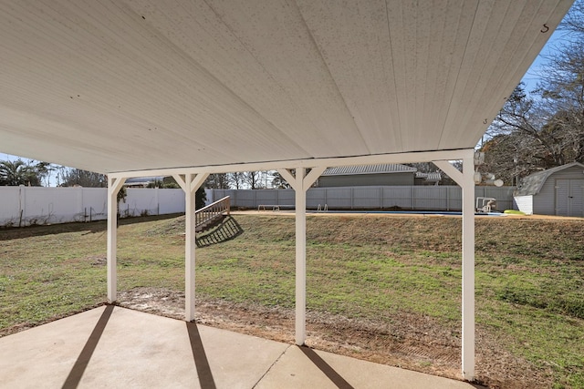 view of patio / terrace with a shed