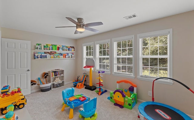 rec room with ceiling fan and carpet floors