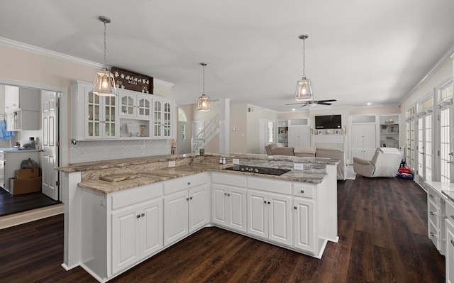 kitchen featuring white cabinets, ceiling fan, dark hardwood / wood-style flooring, and black electric cooktop