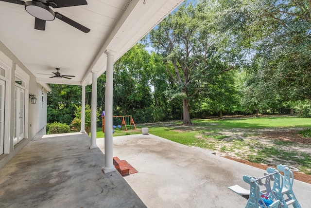 view of patio featuring a playground and ceiling fan