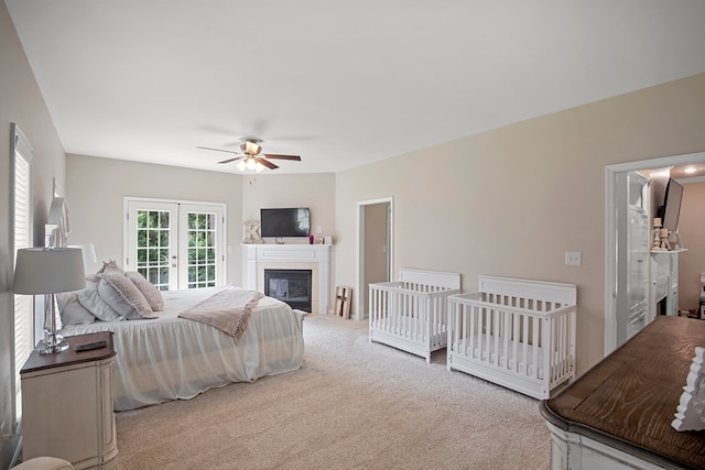 bedroom featuring carpet flooring, ceiling fan, and french doors