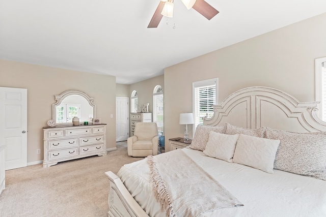 bedroom featuring ceiling fan and light colored carpet