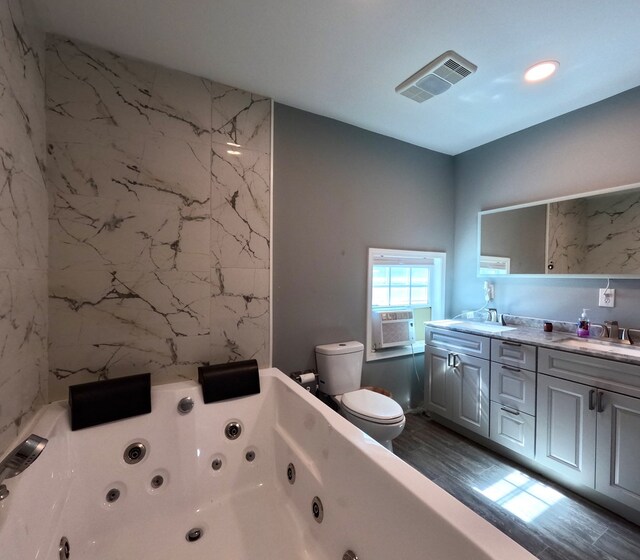 bathroom with a tub to relax in, toilet, hardwood / wood-style flooring, vanity, and cooling unit