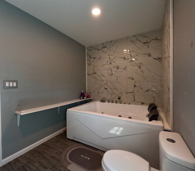 bathroom featuring wood-type flooring, toilet, and a washtub