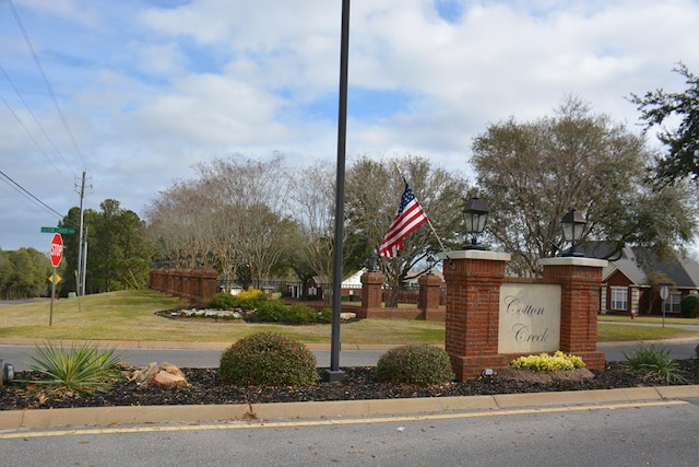 view of street featuring traffic signs and curbs