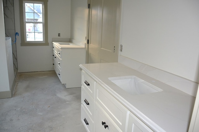 bathroom featuring concrete floors and vanity