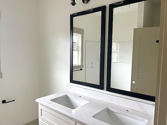 bathroom with double vanity and a sink