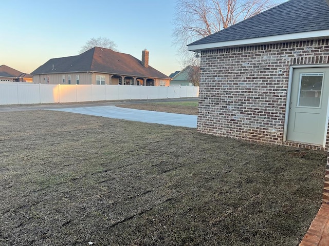 yard at dusk with fence