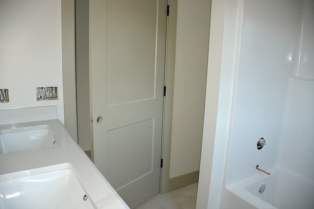 bathroom with shower / washtub combination and vanity