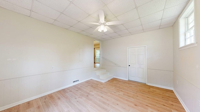 1007 Deborah St, Dothan, AL 36301 - empty room with light wood-type flooring, a paneled ceiling, and a ceiling fan
