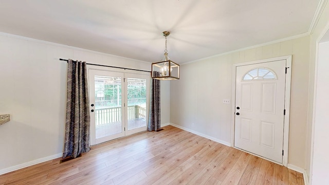 1007 Deborah St, Dothan, AL 36301 - entryway featuring ornamental molding, healthy amount of natural light, light wood-style floors, and a chandelier