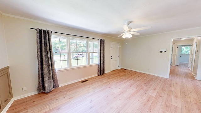 1007 Deborah St, Dothan, AL 36301 - empty room with light wood-style floors, ornamental molding, and ceiling fan