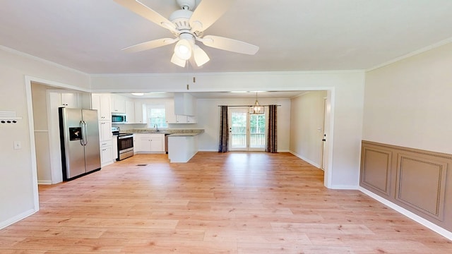 1007 Deborah St, Dothan, AL 36301 - kitchen with appliances with stainless steel finishes, a ceiling fan, crown molding, light wood-style flooring, and white cabinets