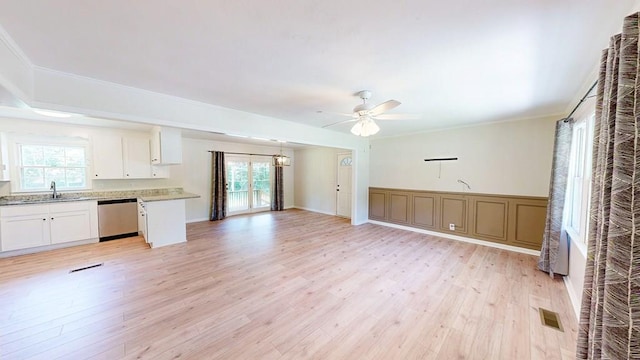 1007 Deborah St, Dothan, AL 36301 - unfurnished living room featuring light wood finished floors, a ceiling fan, and crown molding