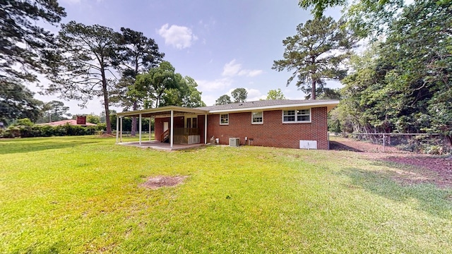 1007 Deborah St, Dothan, AL 36301 - back of property with a patio and brick siding