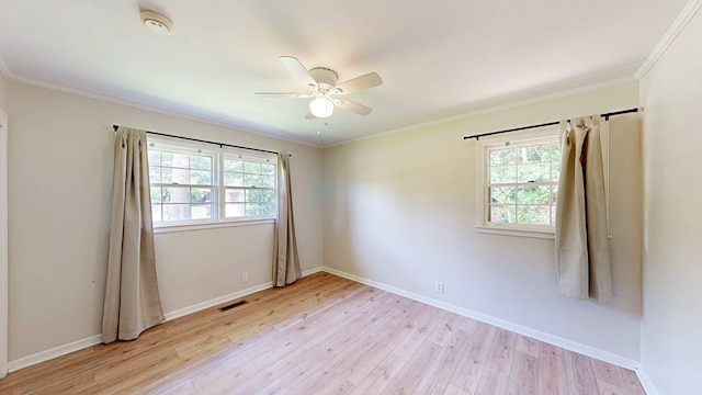 1007 Deborah St, Dothan, AL 36301 - spare room with light wood-style floors, a ceiling fan, a smoke detector, and crown molding