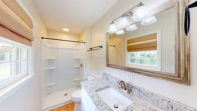 1007 Deborah St, Dothan, AL 36301 - full bathroom featuring a shower, vanity, and wood finished floors