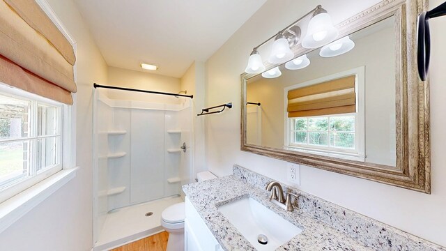 1007 Deborah St, Dothan, AL 36301 - full bathroom featuring a shower, vanity, and wood finished floors