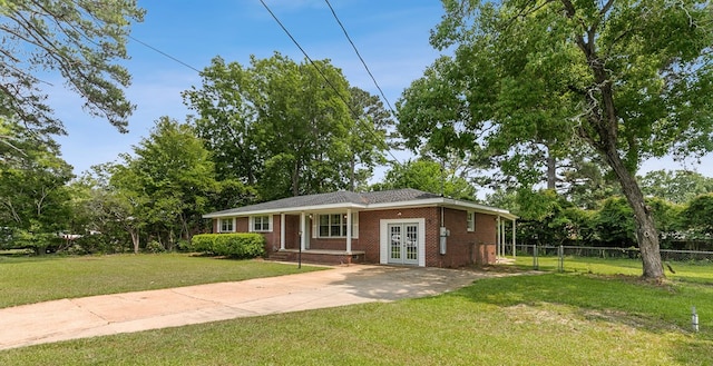 1007 Deborah St, Dothan, AL 36301 - view of front of home featuring french doors, brick siding, and concrete driveway